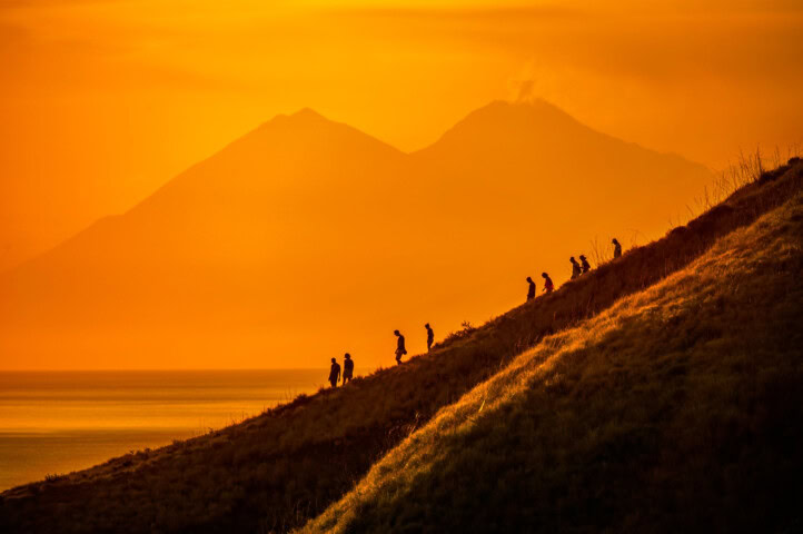 A group of people hiking Komodo Island.