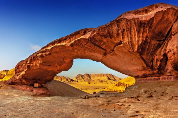 A rock archway in Wadi Rum desert.