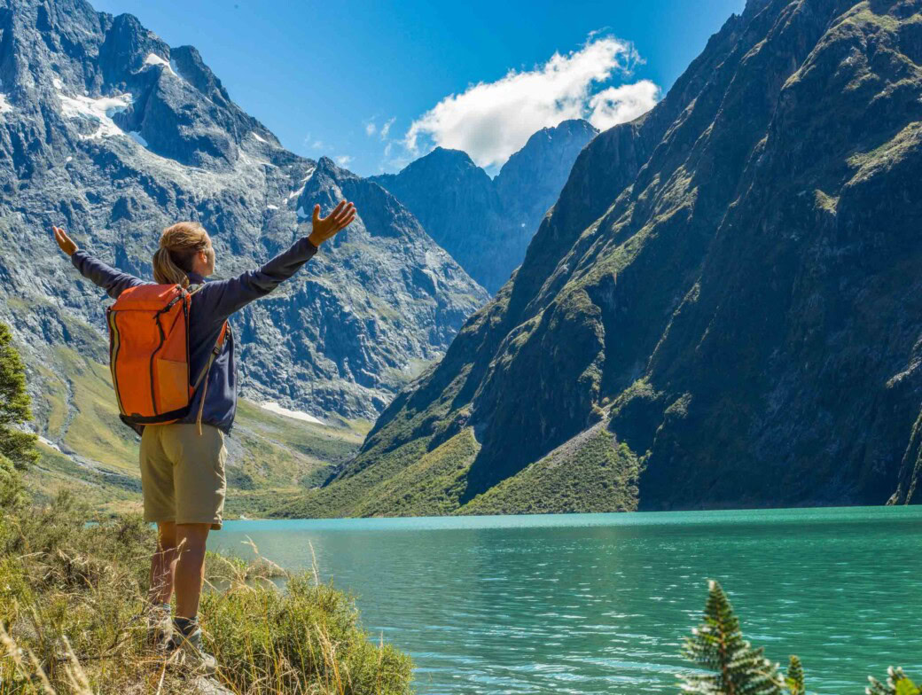 A traveler reaches Lake Marian in New Zealand.