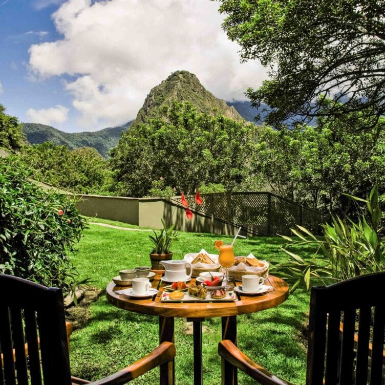 A meal for two set up outdoors after a hiking trip to Machu Picchu's Sanctuary Lodge