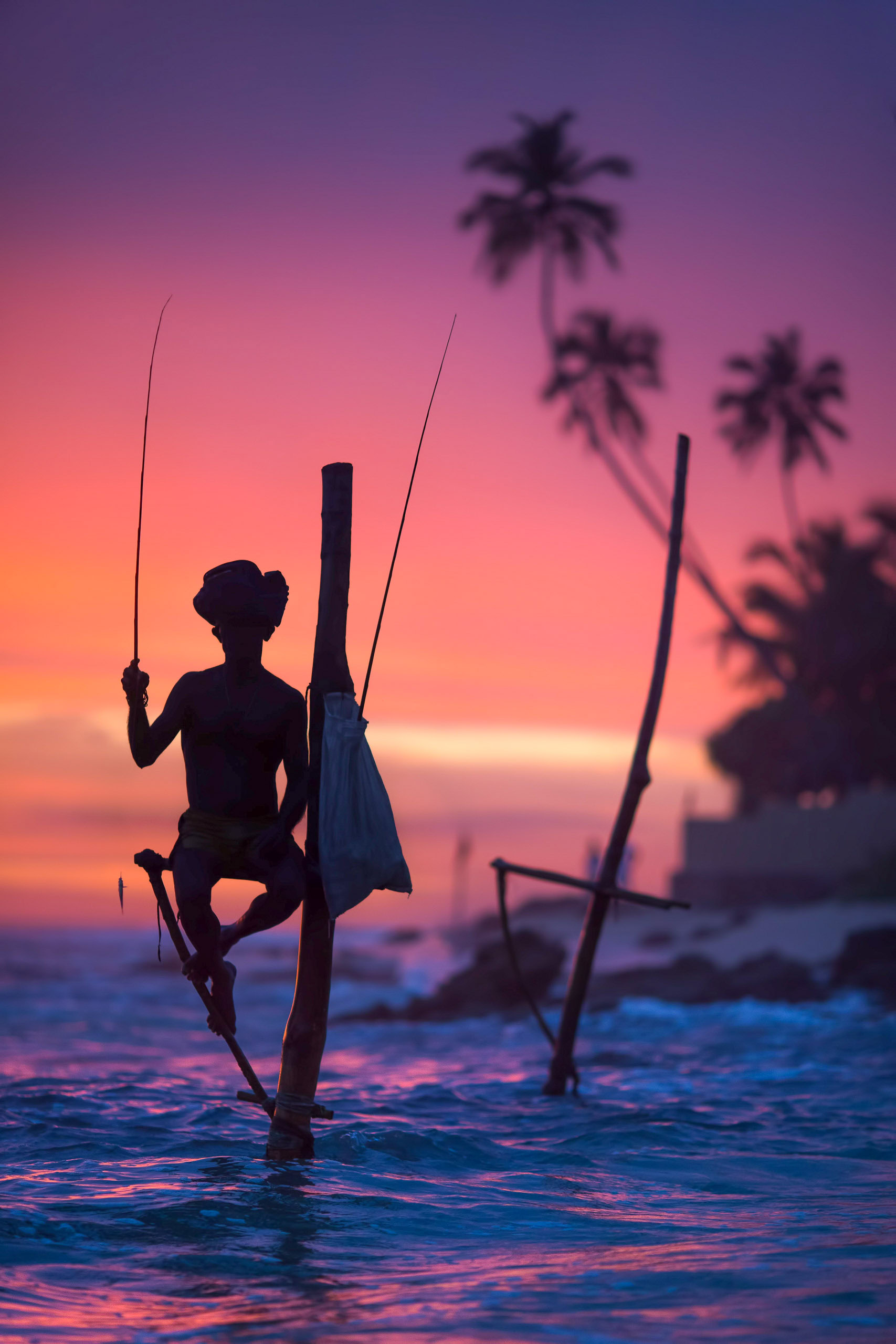 A stilt fisherman at sunset.