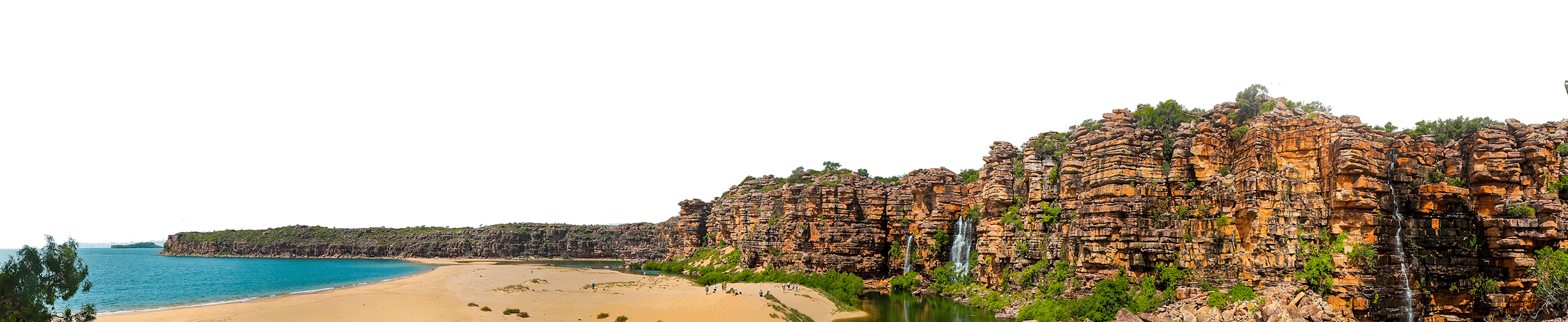 Panoramic view of a coastal travel destination featuring sandy beaches, clear blue water, and rugged cliffs with vegetation.
